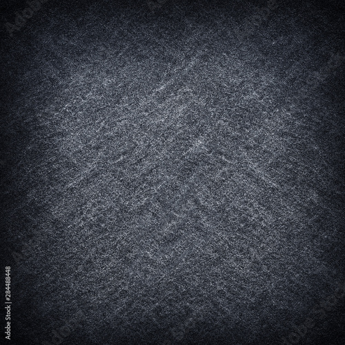 Dark grey black slate stone background or texture.