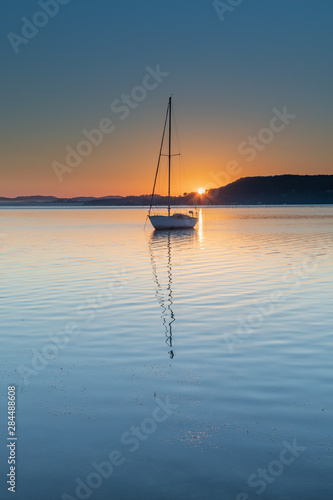 Clear Skies, a Boat and a Winters Sunrise by the Bay © Merrillie