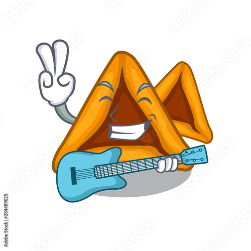 With guitar hamantaschen cookies isolated with the mascot