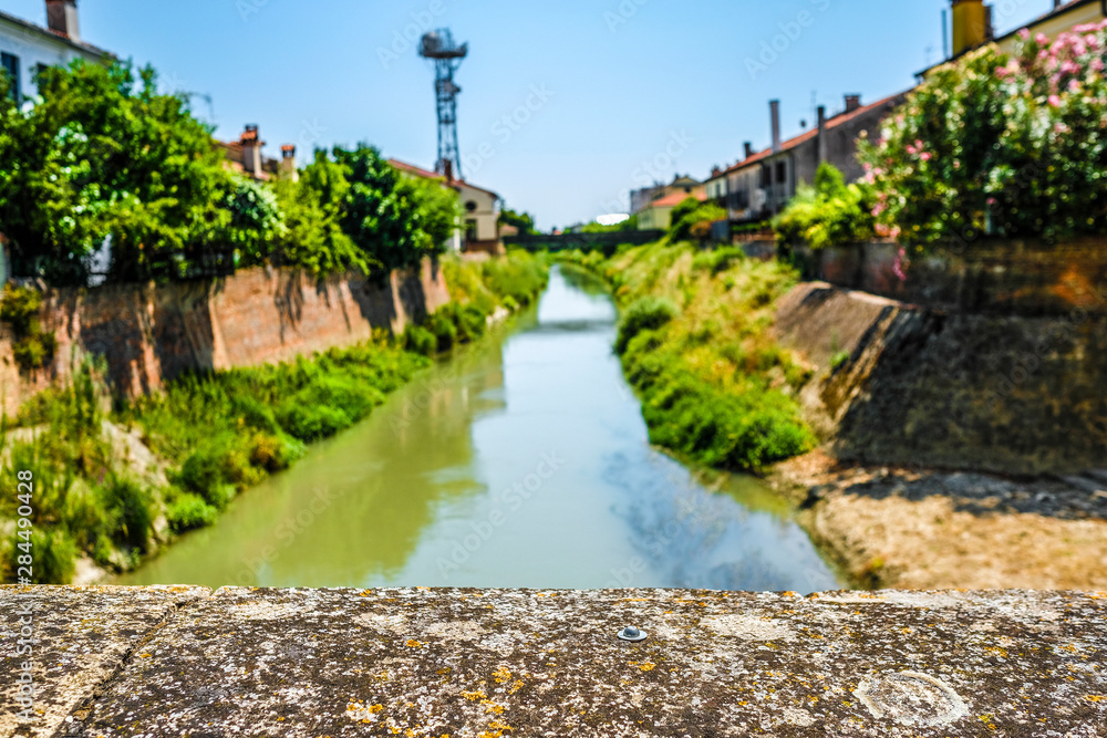 Este, Italy - July, 27, 2019: Landscape with the image of channel in Este, Italy