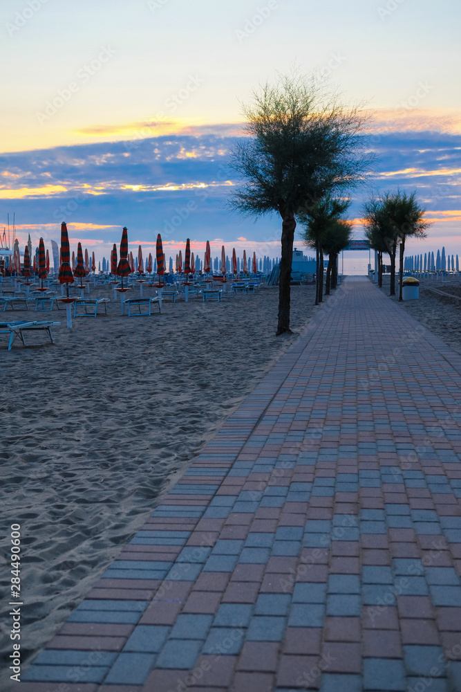 Sottomarina, Italy - July, 29, 2019: sea beach in Sottomarina, Italy, at sunrise