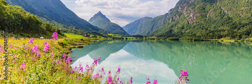 Mountain panorama with mountain Eggenipa reflecting in a lake in Gloppen along highway E39 in Sogn og Fjorden county in Norway