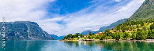 View on Ornes, famous for Urnes Stave Church, from the liitle ferry crossing Lustrafjorden between Solvorn and Ornes, Sogn og Fjordane in Norway.