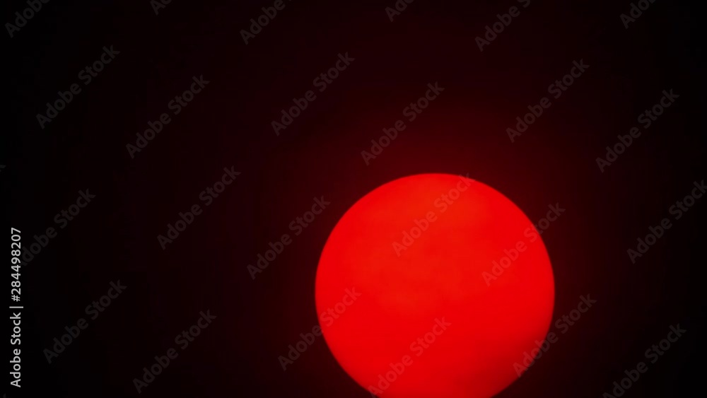 Red sun sphere in thick smog Red sun sphere in thick smog