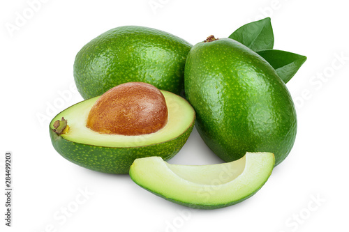 avocado and half with leaves isolated on white background close-up