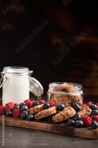 Delicious and organic chocolate chips ready to be eaten from a wooden plate