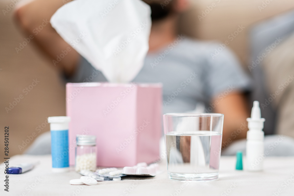 High temperature concept. Man feels badly ill. How to bring fever down. Cold symptoms and causes. Sick man with flu. Measure temperature. Break fever remedies. High temperature concept. Man feels badly ill. How to bring fever down. Cold symptoms and causes. Sick man with flu. Measure temperature. Break fever remedies.