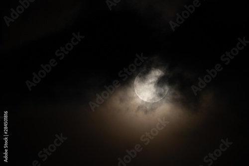 Moon light behind cloud