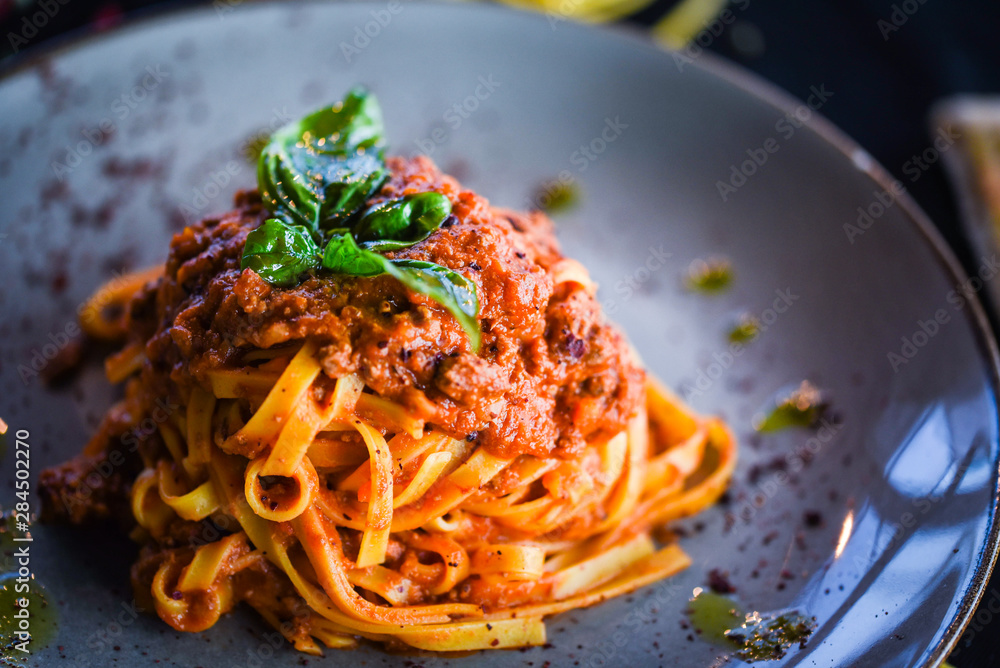 delicious italian spaghetti bolognese with minced beef sauce, tomatoes, carrots & fresh basil delicious italian spaghetti bolognese with minced beef sauce, tomatoes, carrots & fresh basil