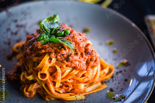 delicious italian spaghetti bolognese with minced beef sauce, tomatoes, carrots & fresh basil 