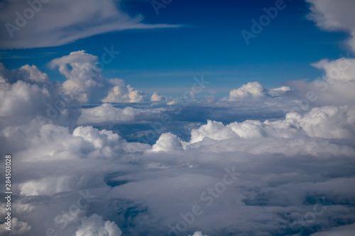beautiful sky and clouds from window of plane