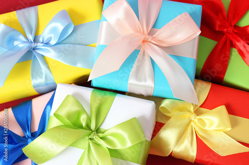 gifts on a colored background top view. Holiday, giving presents, birthday.