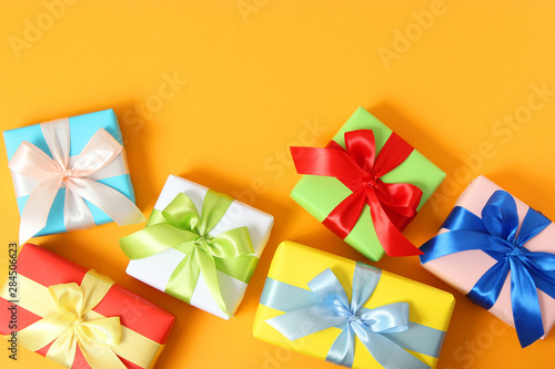 gifts on a colored background top view. Holiday  giving presents  birthday.