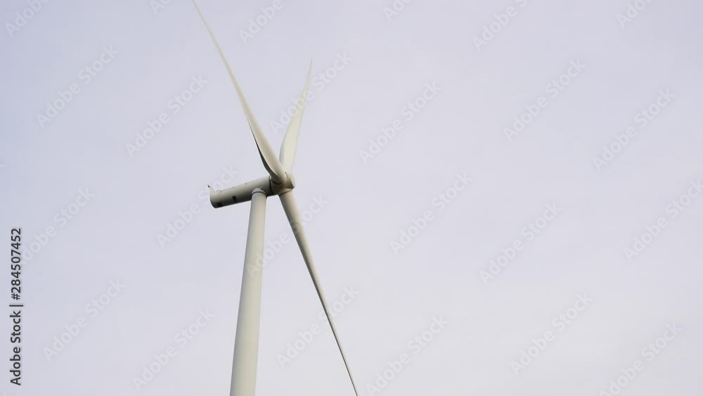 Wind turbines of save Energy save world in video 4k format. aerial shot on sunset. drone footage turbines at sunrise with beautiful clouds Wind turbines of save Energy save world in video 4k format. aerial shot on sunset. drone footage turbines at sunrise with beautiful clouds
