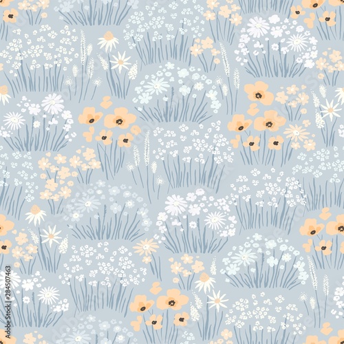 Meadow with wildflowers, abstract seamless floral pattern. Vector doodle illustration in vintage style.
