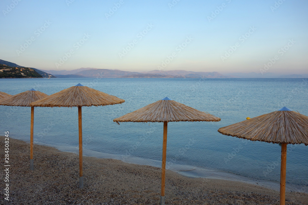 Straw umbrellas on a beach