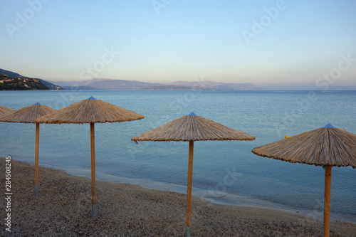 Straw umbrellas on a beach