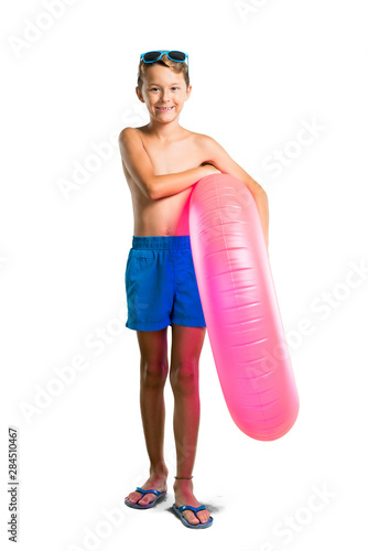 A full-length shot of Child on summer vacation keeping arms crossed on isolated white background