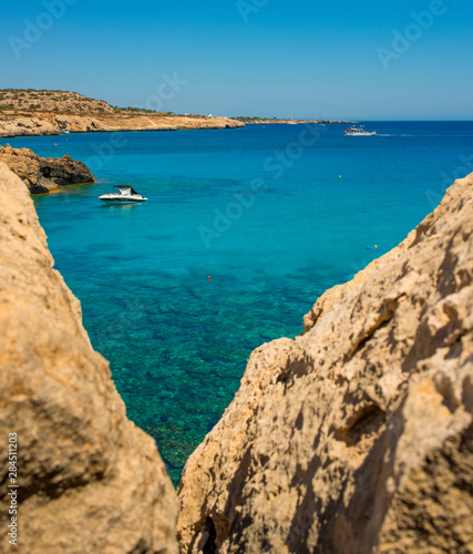  colorful pristine nature of the coast of Cyprus cape cavo greco with clear blue water and yellow rocks