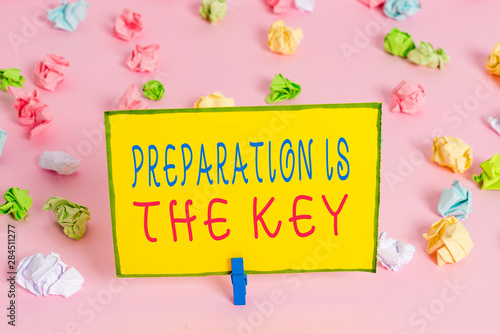 Word writing text Preparation Is The Key. Business photo showcasing it reduces errors and shortens the activities Colored crumpled papers empty reminder pink floor background clothespin © Artur
