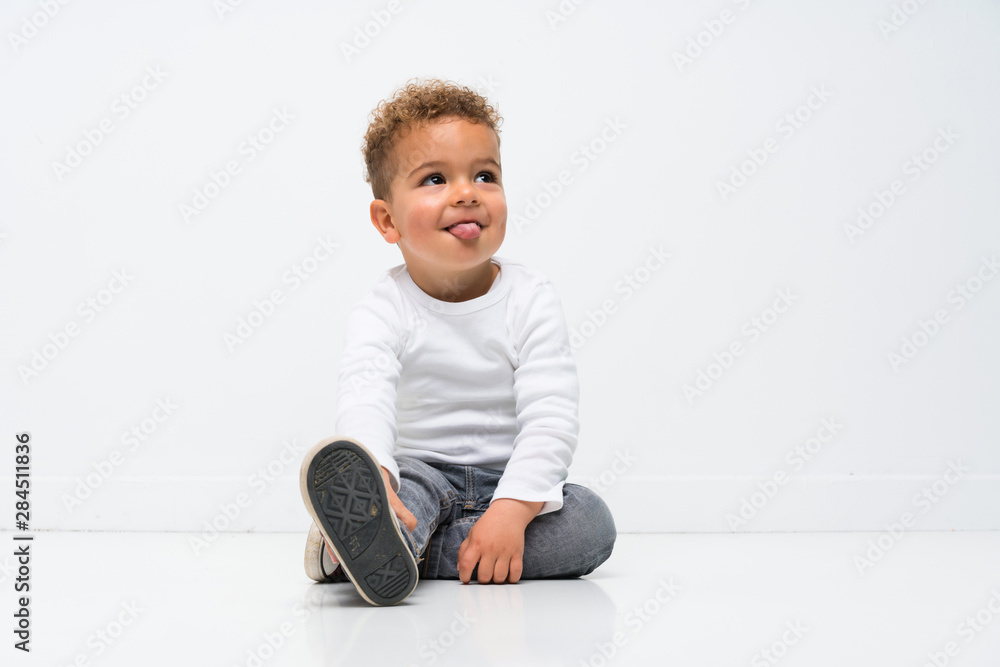 Happy kid over isolated white background Happy kid over isolated white background