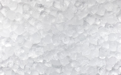 Ice cubes scattered on white for advertisement