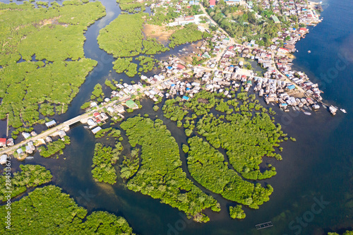 Town on the water and mangroves, top view. Coast of the island of Siargao. Tropical landscape.