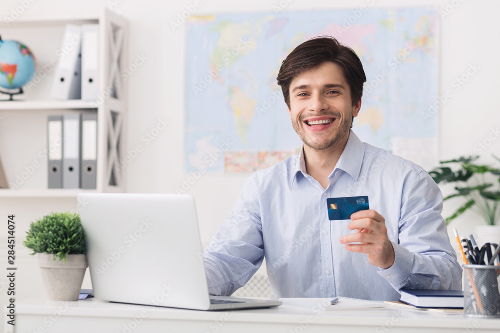Booking tour online. Travel agent showing credit card Booking tour online. Travel agent showing credit card
