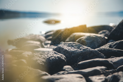 Stones on the shore of the lake, details of nature, soft focus, beautiful landscape photo