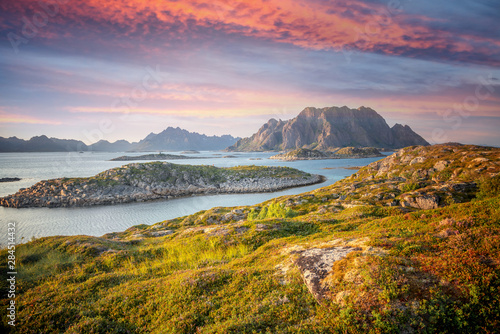 sunset over the mountains and the sea of Lofoten islands in Norway