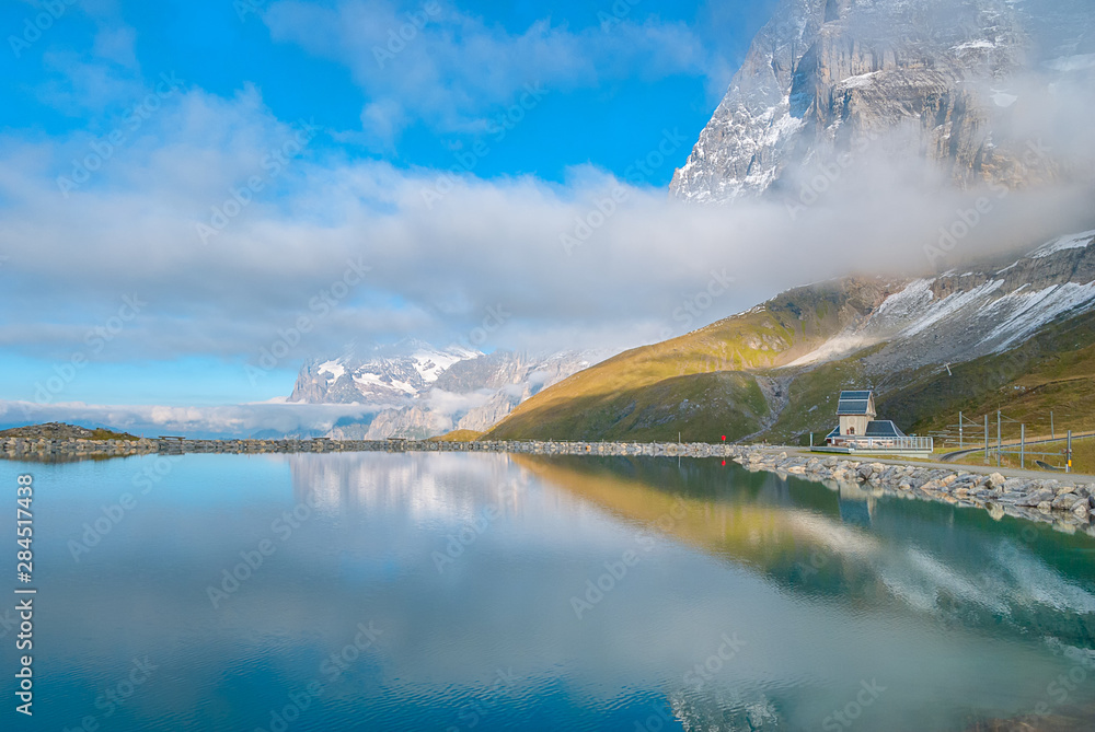 Fallbodensee lake with amazing mountain reflection in Jungfrau region, Switzerland