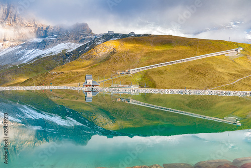 Fallbodensee lake with amazing mountain reflection in Jungfrau region, Switzerland photo