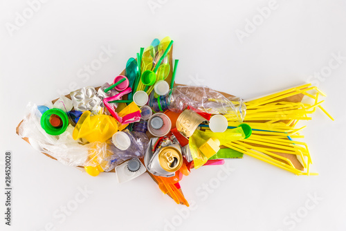 a plastic fish made of disposable and waste plastics, ecology concept