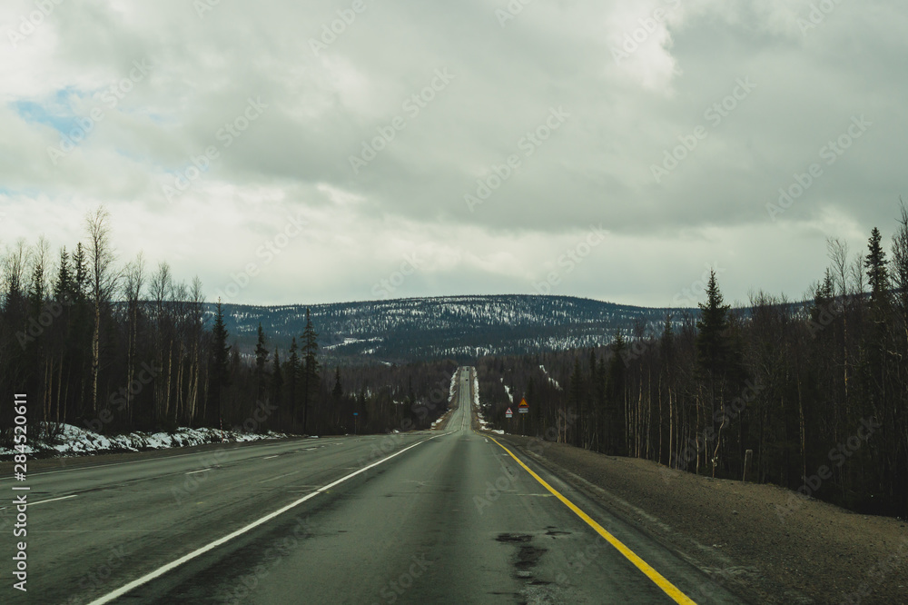 Mountain road. highway in mountains. way with long distance view Mountain road. highway in mountains. way with long distance view