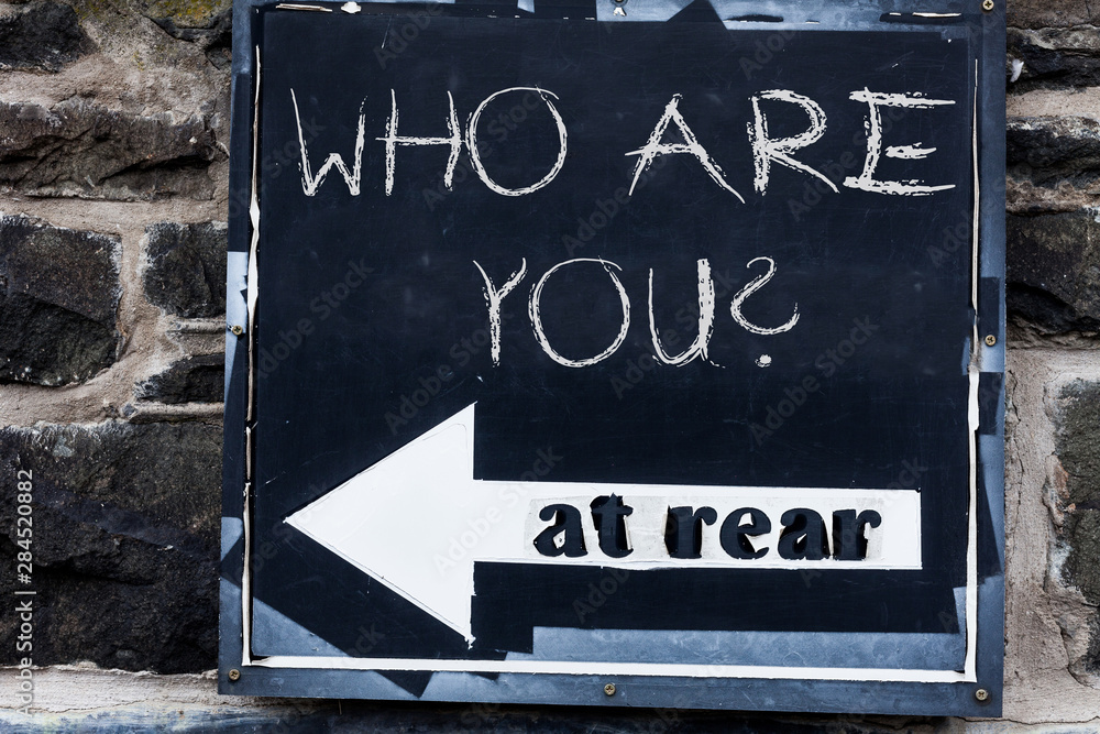 Obraz premium Word writing text Who Are You Question. Business photo showcasing asking about someone identity or demonstratingal information Advertisement concept with empty copy space on the road sign