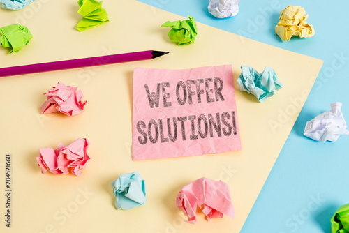 Conceptual hand writing showing We Offer Solutions. Concept meaning way to solve problem or deal with difficult situation Colored crumpled papers empty reminder blue yellow clothespin © Artur