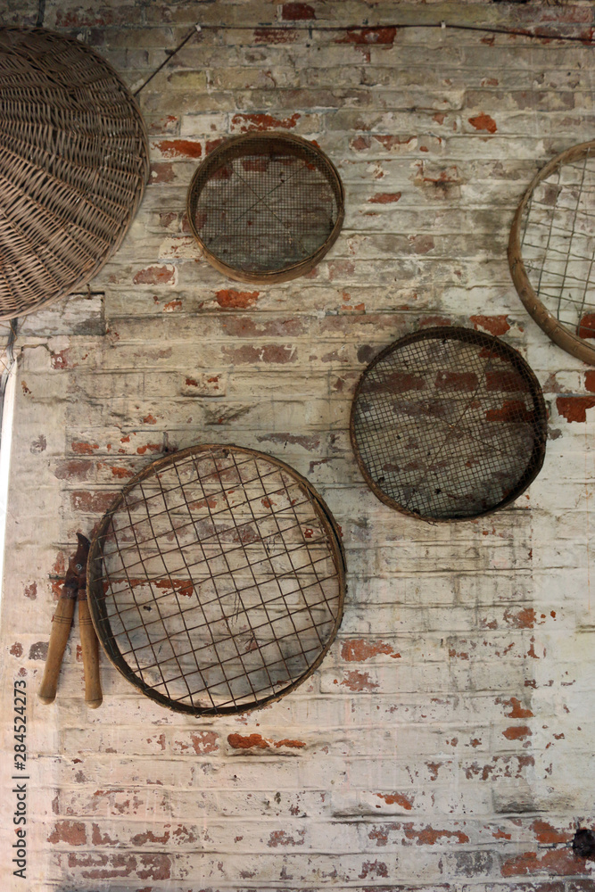 Gardening sieves hanging on a wall Gardening sieves hanging on a wall
