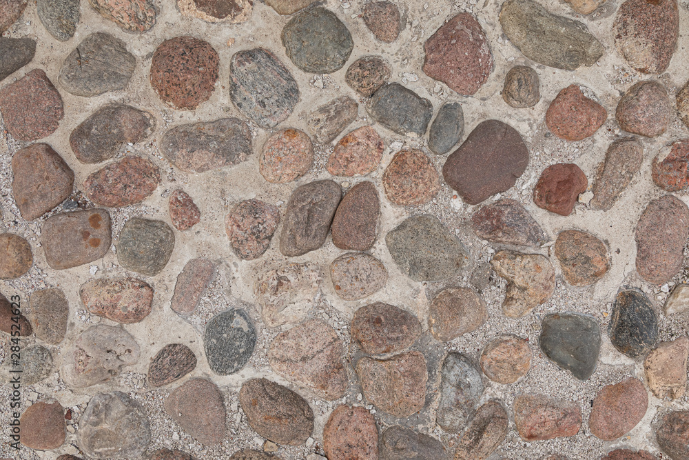Colorful cobblestone pavement flatlay, background with grunge texture Colorful cobblestone pavement flatlay, background with grunge texture