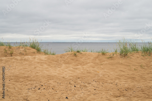 Wallpaper Mural Sand beach in the bay under cloudy sky Torontodigital.ca