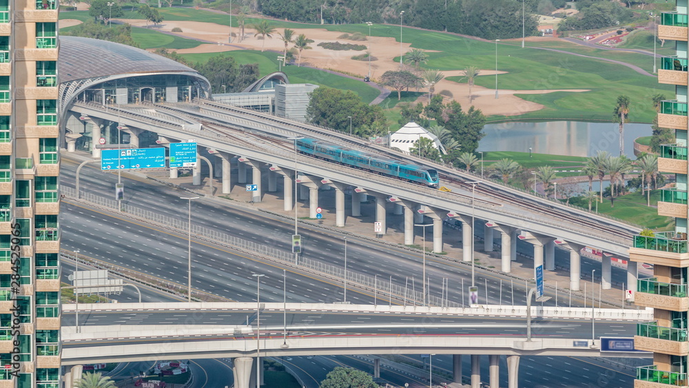 Fototapeta premium Metro station services both the Dubai Internet City and Dubai Media City districts of Dubai, as well as Golf Club timelapse