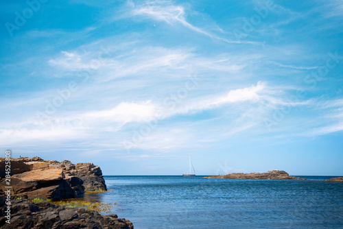 Sailboat on the sea under a blue sky