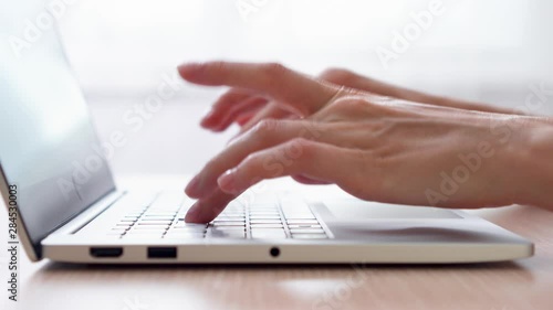 Woman freelancer working on laptop at home-office. Close up of female hands typing on keyboard. Businesswoman writing business letter at work. Dolly shot