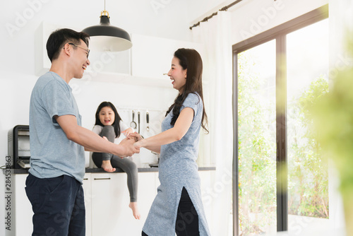 happiness asian family dad dancing with mom and daughter togehter home sweet home concept
