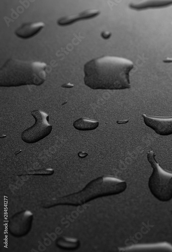 Water drops on the black surface
