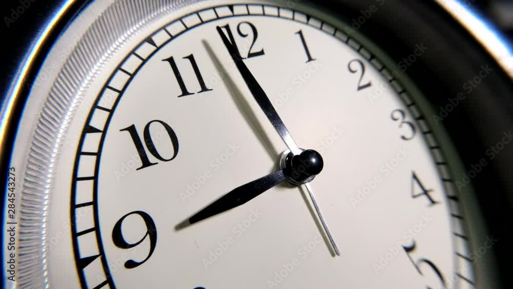 The Clock With Black Arrows Shows The Time Nine Hours Timelapse. The Clock With Black Arrows Shows The Time Nine Hours Timelapse.