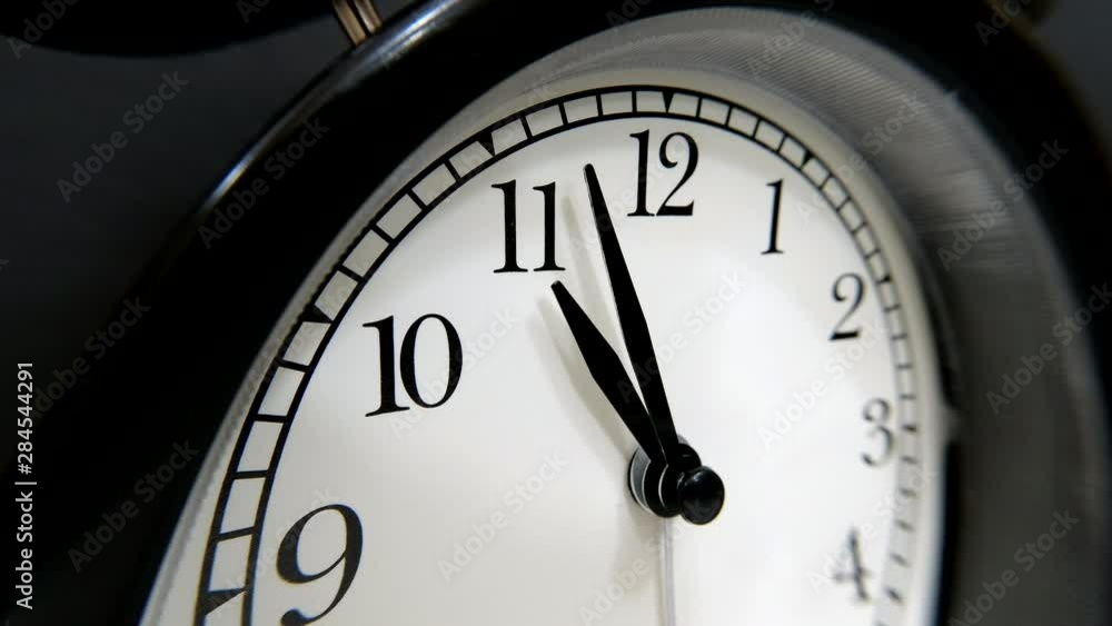 The Clock With Black Arrows Shows The Time Eleven Hours Timelapse. The Clock With Black Arrows Shows The Time Eleven Hours Timelapse.