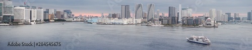 Photography Tokyo tourist seaport with the piers of Takeshiba on the left, of Tsukishima in the center and the Harumi passenger terminal on the right at twilight