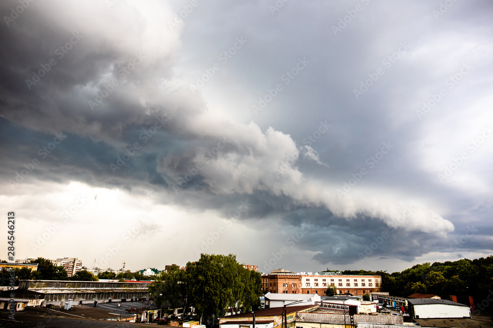 dramatic gray stormy sky with a big cloud over the city dramatic gray stormy sky with a big cloud over the city