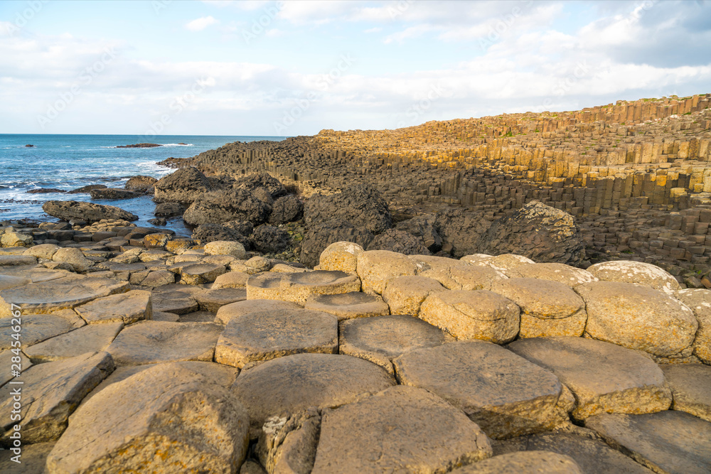 Giant's Causeway in Norther Ireland under Blue Sky Giant's Causeway in Norther Ireland under Blue Sky