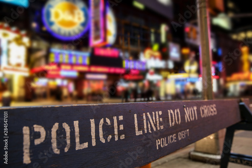 Police line crime scene in New York City with blurry background